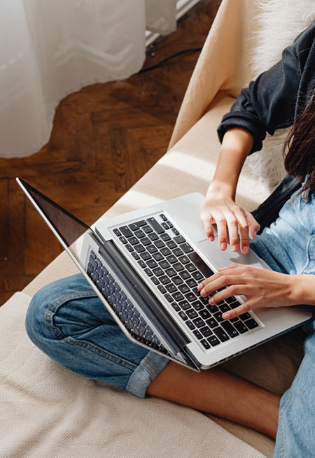 woman typing on laptop